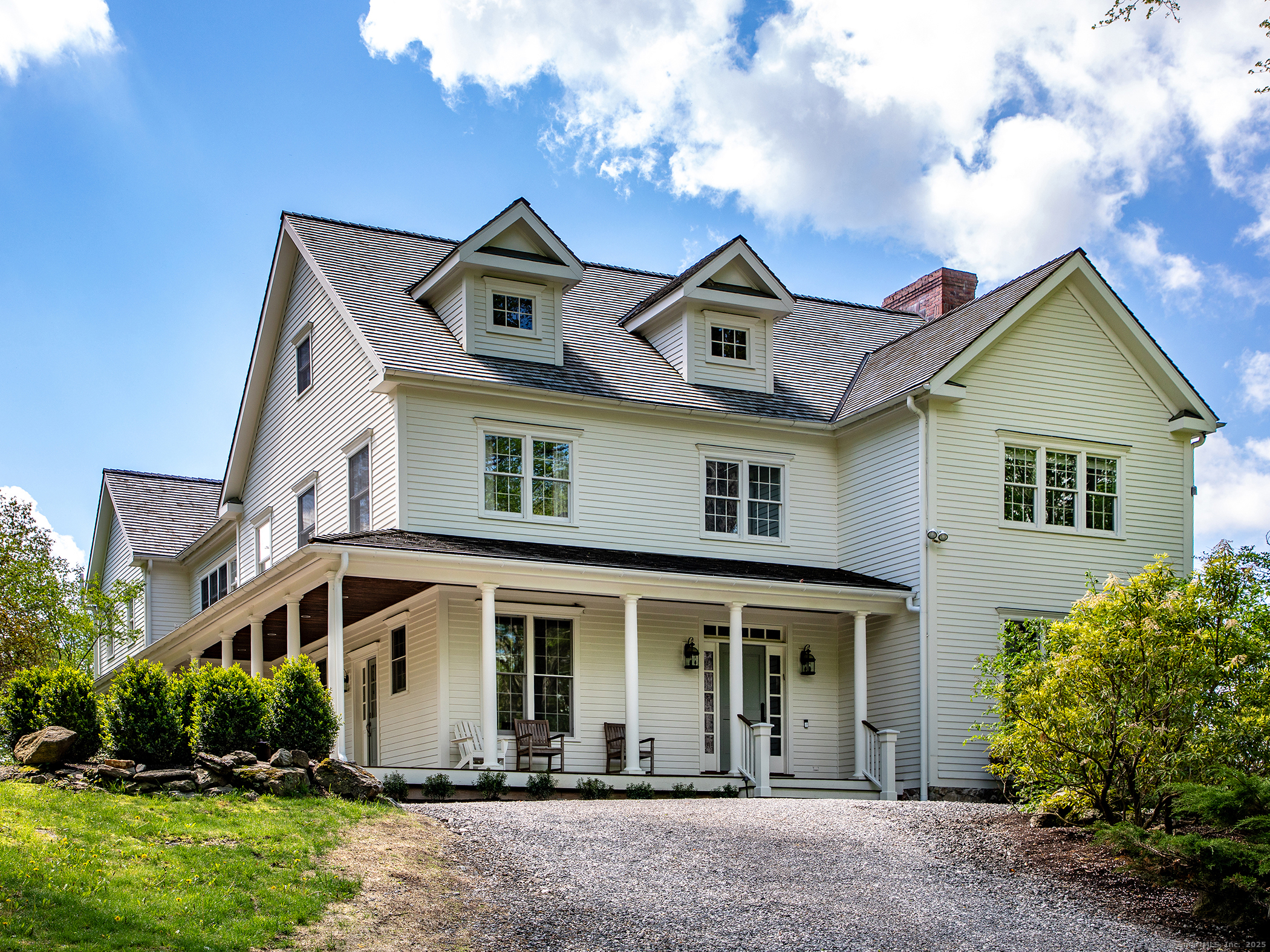 143 Tophet Road Roxbury, CT 06783 - Photo 3 of 40 a front view of a house with yard and trees