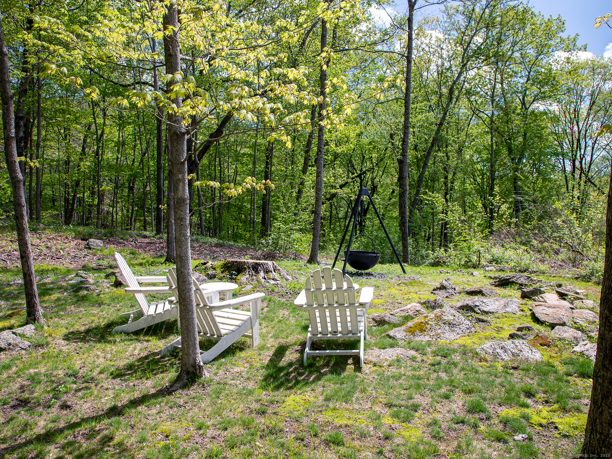143 Tophet Road Roxbury, CT 06783 - Photo 34 of 40 a backyard of a house with table and chairs