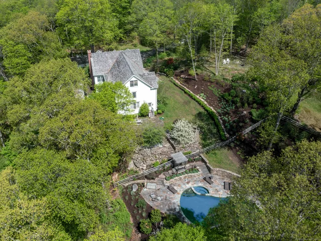 an aerial view of residential house with outdoor space