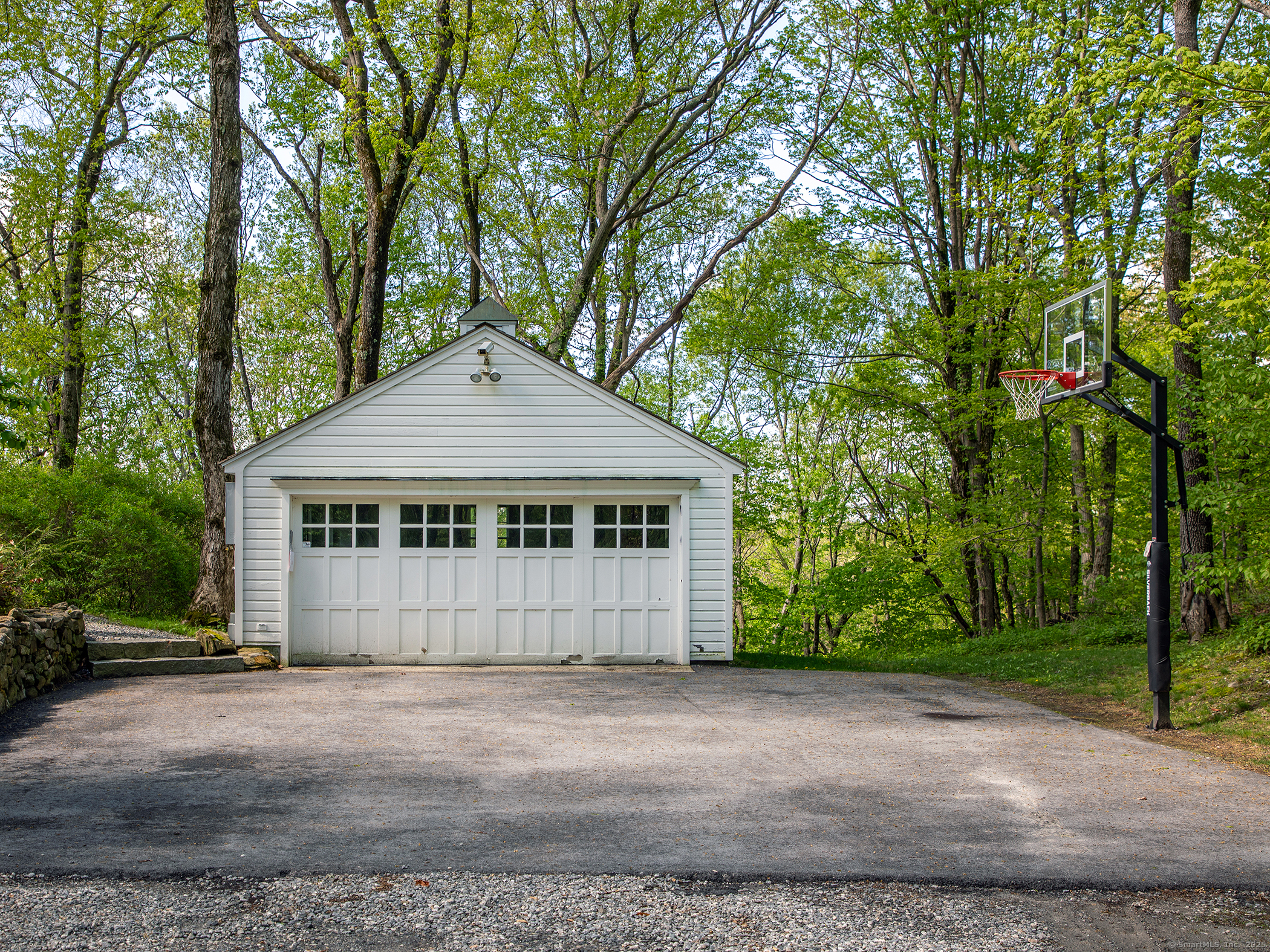 143 Tophet Road Roxbury, CT 06783 - Photo 38 of 40 a front view of a house with a yard and garage