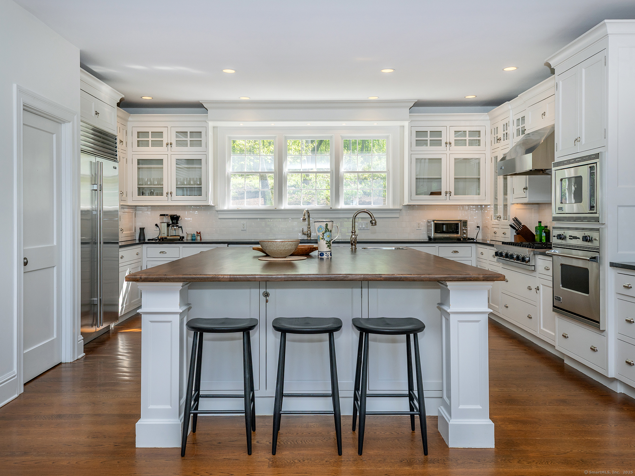 143 Tophet Road Roxbury, CT 06783 - Photo 5 of 40 a kitchen with granite countertop a table chairs stove and cabinets