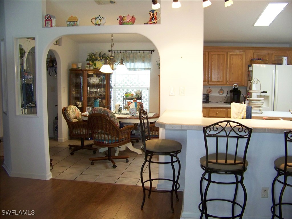15550 Burnt Store Road, Unit 128 Punta Gorda, FL 33955 - Photo 14 of 50 a view of a livingroom with furniture and a window
