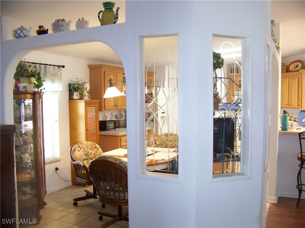 15550 Burnt Store Road, Unit 128 Punta Gorda, FL 33955 - Photo 21 of 50 a living room with furniture and a window