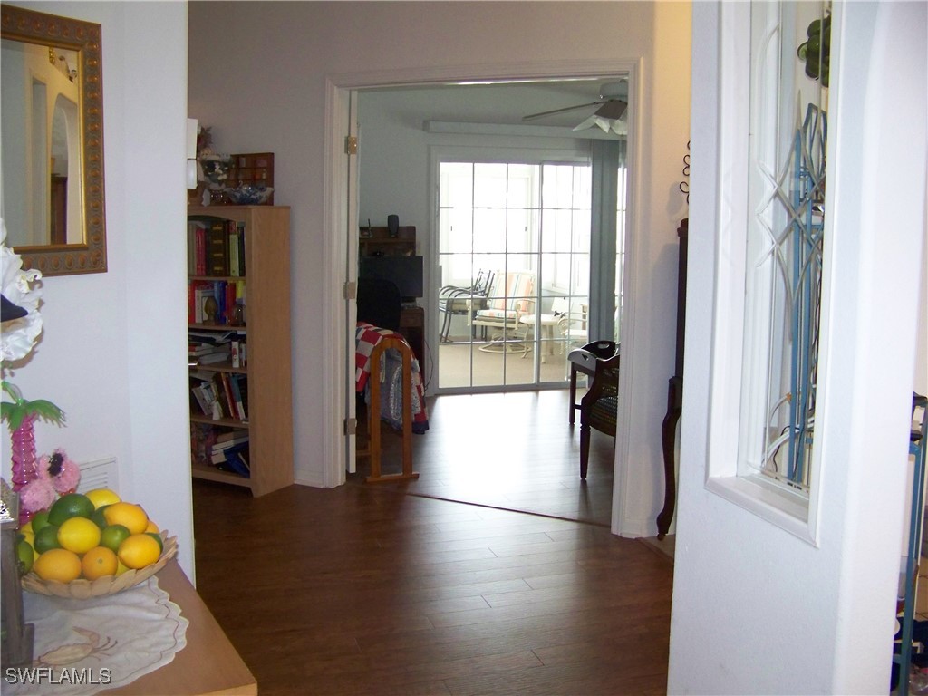 15550 Burnt Store Road, Unit 128 Punta Gorda, FL 33955 - Photo 39 of 50 a view of hallway with wooden floor and furniture
