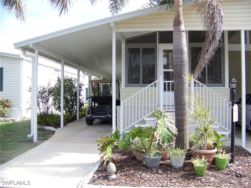 15550 Burnt Store Road, Unit 128 Punta Gorda, FL 33955 - Photo 4 of 50 a garden view with a seating space