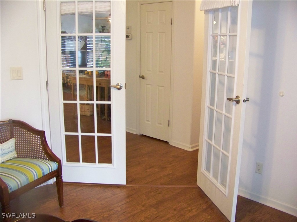 15550 Burnt Store Road, Unit 128 Punta Gorda, FL 33955 - Photo 42 of 50 a view of a bedroom with wooden floor and closet