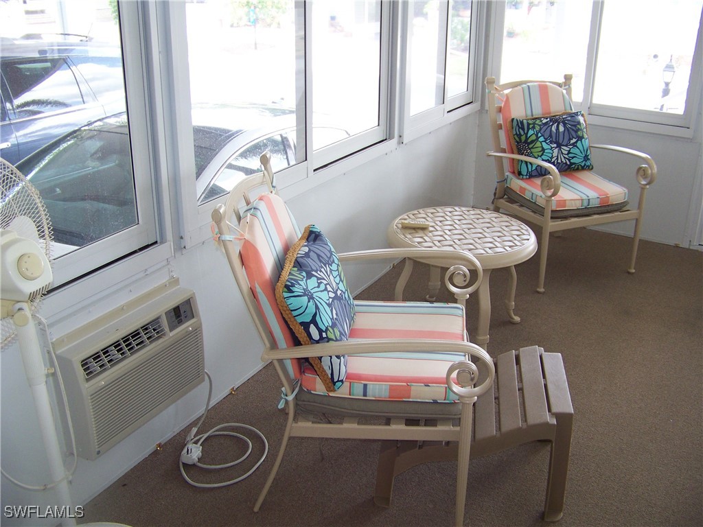 15550 Burnt Store Road, Unit 128 Punta Gorda, FL 33955 - Photo 44 of 50 a room with furniture and window