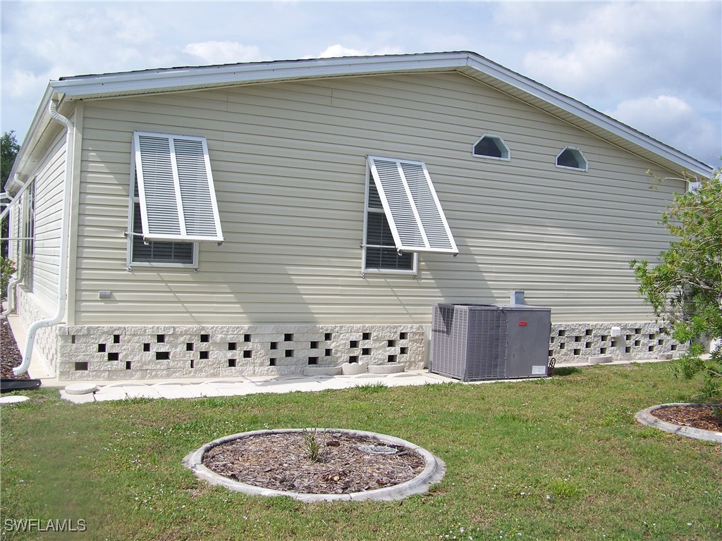 15550 Burnt Store Road, Unit 128 Punta Gorda, FL 33955 - Photo 6 of 50 a view of an house with backyard space and garden