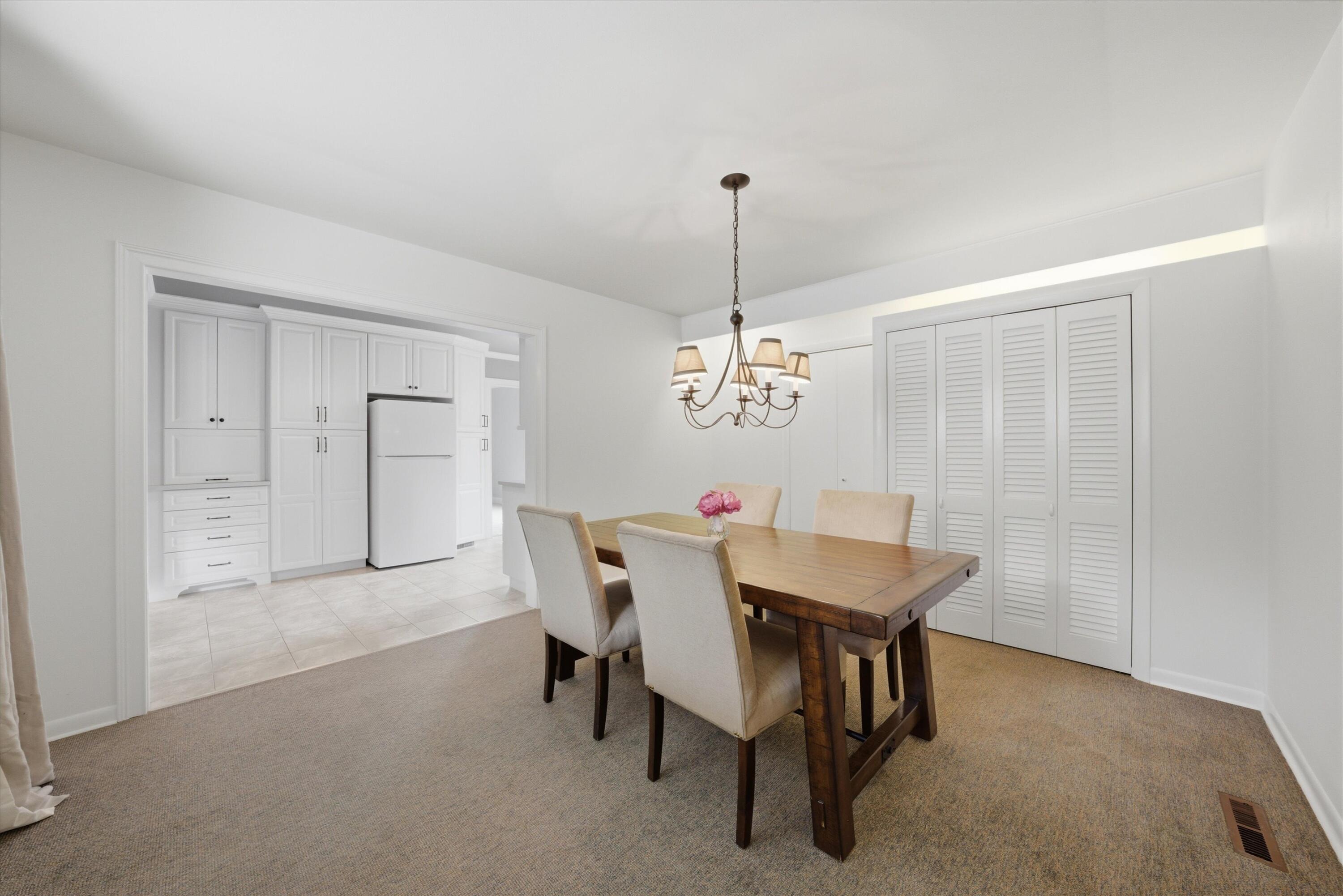 1034 North Indiana Street Griffith, IN 46319 - Photo 5 of 17 a view of a dining room with furniture and chandelier