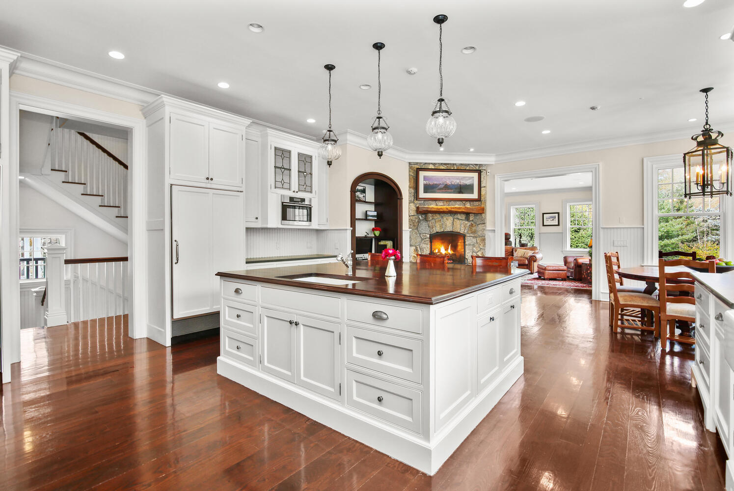 363 West Road New Canaan, CT 06840 - Photo 19 of 68 a large white kitchen with stainless steel appliances