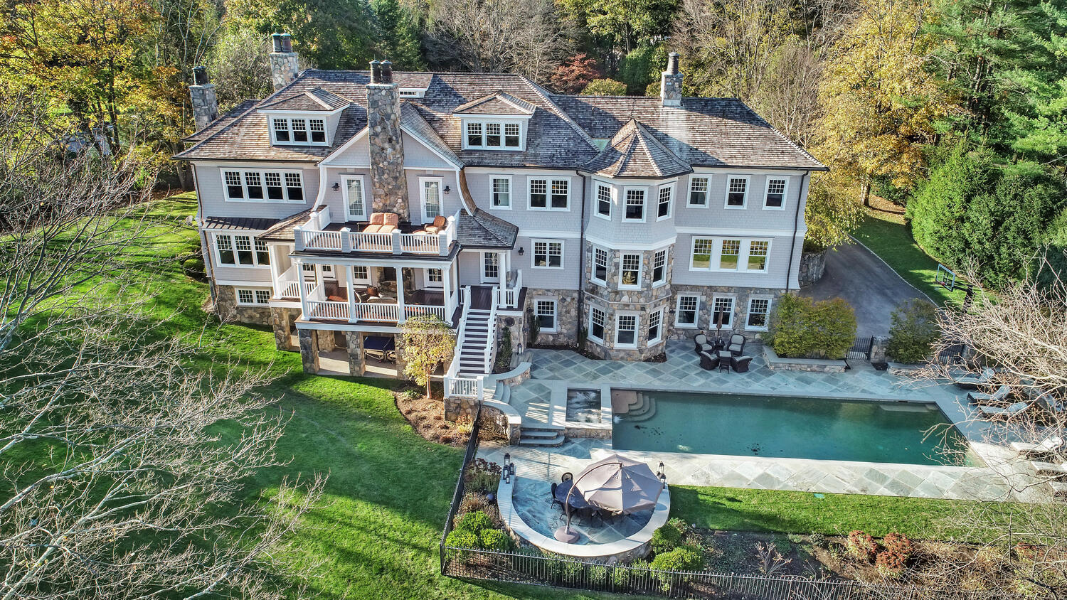 363 West Road New Canaan, CT 06840 - Photo 3 of 68 a aerial view of a house with swimming pool and a yard
