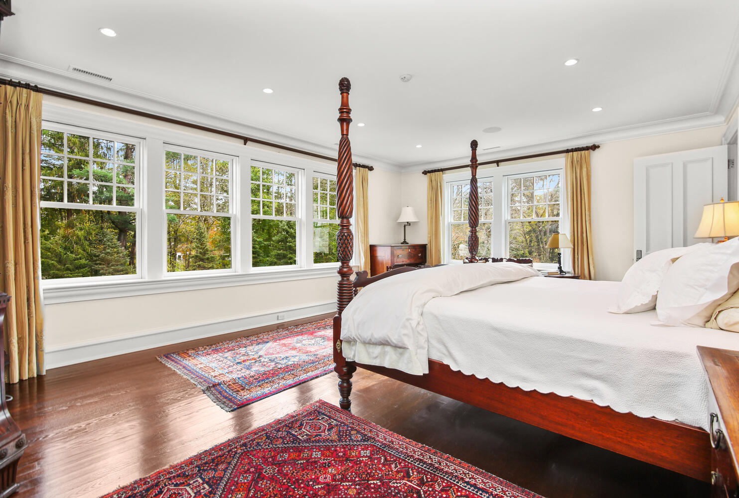 363 West Road New Canaan, CT 06840 - Photo 28 of 68 a spacious bedroom with a large window and a bed