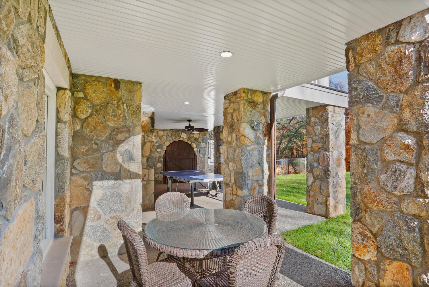 363 West Road New Canaan, CT 06840 - Photo 48 of 68 a dining room with furniture and a fireplace