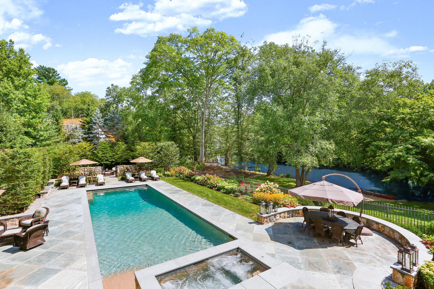 363 West Road New Canaan, CT 06840 - Photo 6 of 68 an aerial view of a house with swimming pool garden and patio