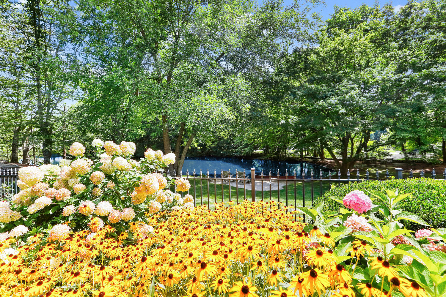 363 West Road New Canaan, CT 06840 - Photo 52 of 68 a view of swimming pool with a patio and garden