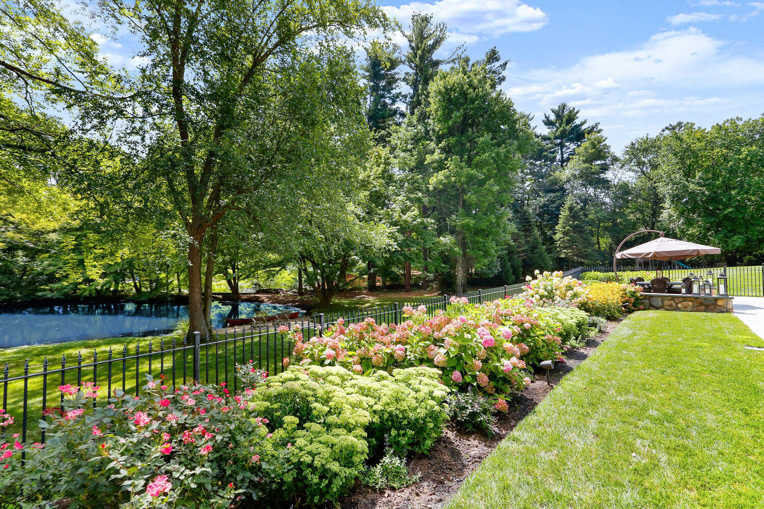 363 West Road New Canaan, CT 06840 - Photo 54 of 68 a view of a garden with flowers and trees