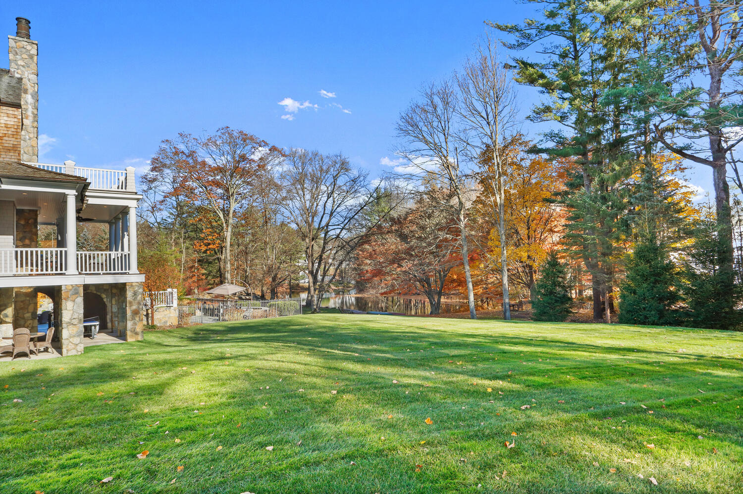 363 West Road New Canaan, CT 06840 - Photo 58 of 68 a view of a building with a big yard and large trees