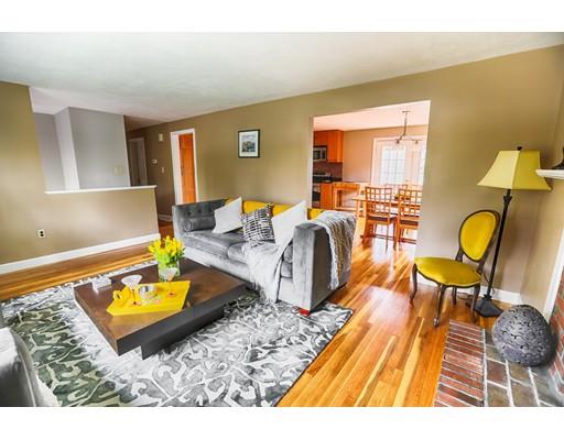 39 Vaille Avenue Lexington, MA 02421 - Photo 7 of 27 a living room with furniture a rug and a lamp