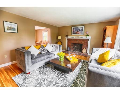 39 Vaille Avenue Lexington, MA 02421 - Photo 8 of 27 a living room with furniture and a fireplace