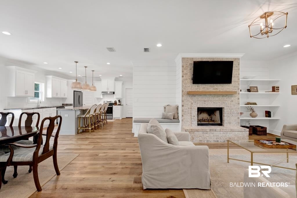 379 Pecan Ridge Boulevard Fairhope, AL 36532 - Photo 21 of 21 Open-concept living space with wood-finish flooring throughout