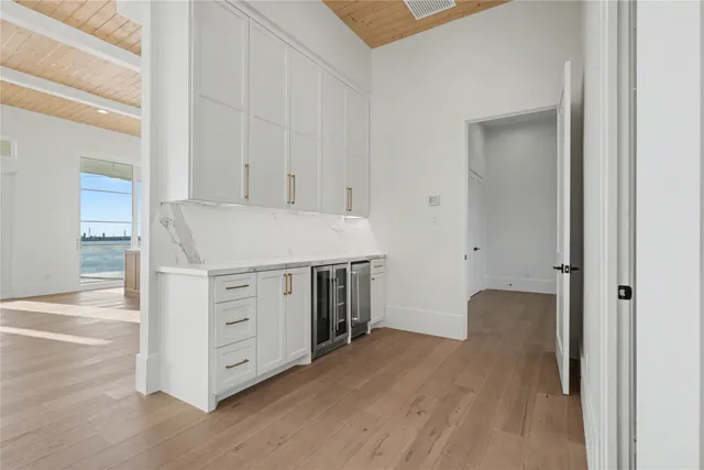 a view of cabinets and wooden floor