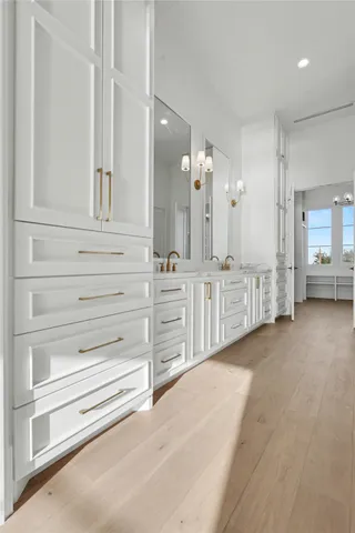 a view of a hallway with chandelier