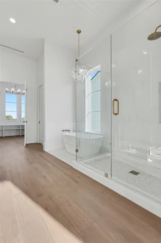 a bathroom with a tub and shower