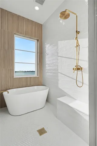 a bathroom with a bathtub and a shower