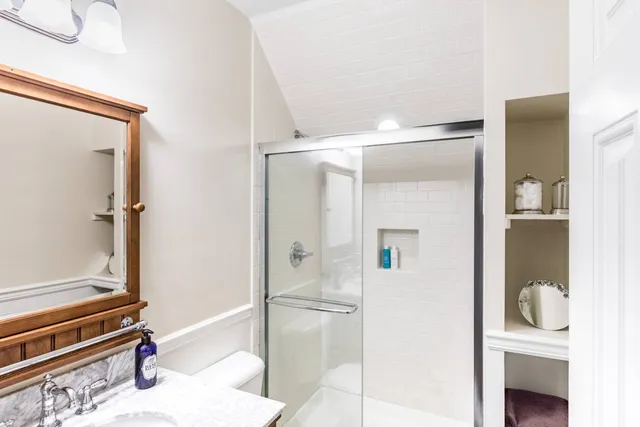 a bathroom with a tub and shower