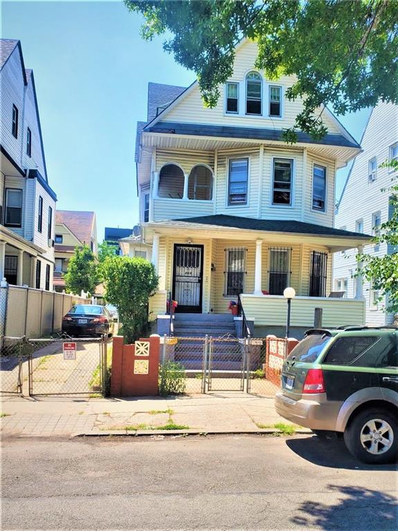 464 East 26th Street Brooklyn, NY 11226 - Photo 1 of 3 a front view of a house with parking space