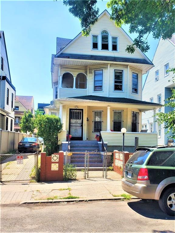 464 East 26th Street Brooklyn, NY 11226 - Photo 2 of 3 a front view of a house with a yard