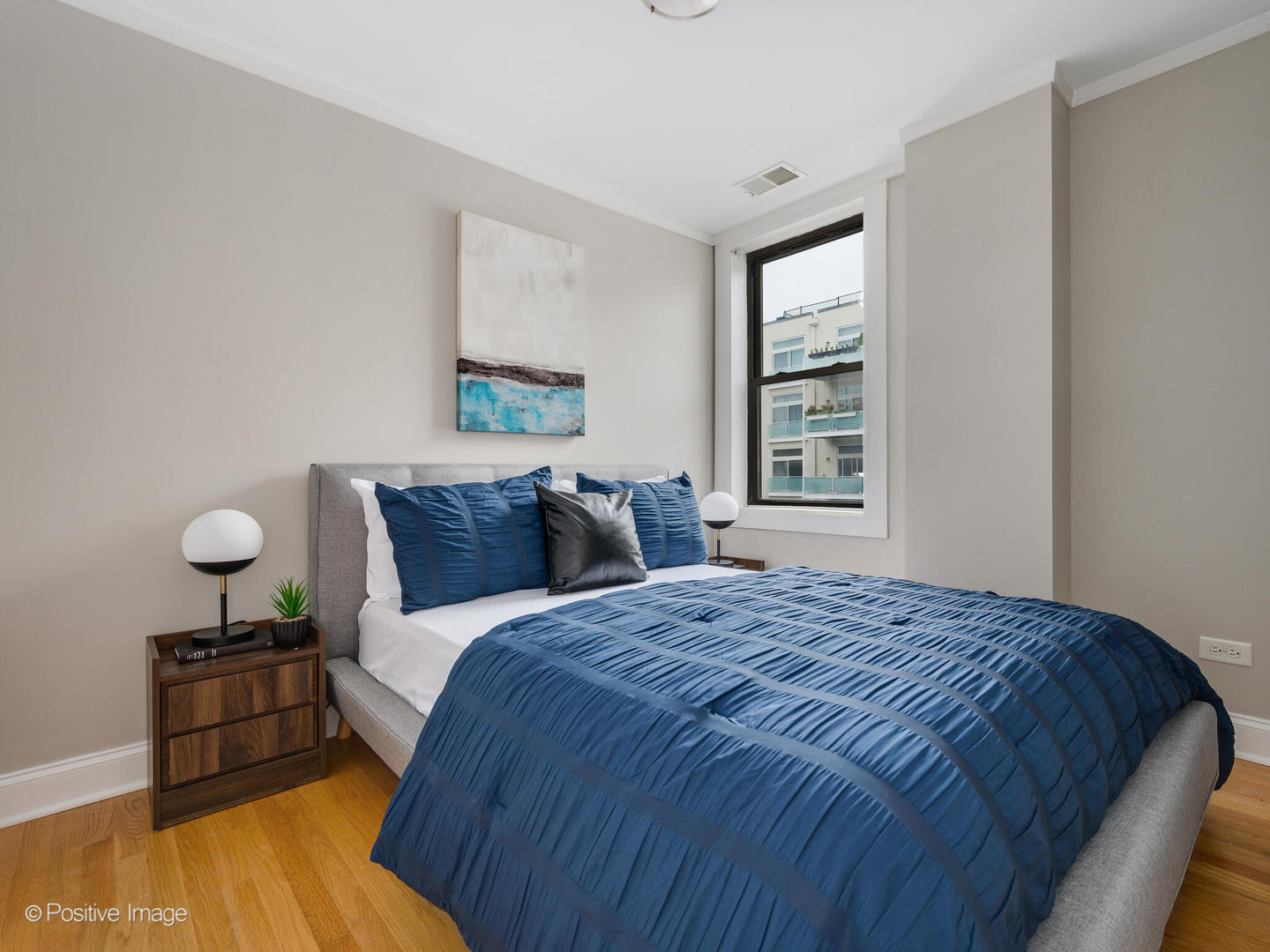 4144 North Sheridan Road, Unit 203 Chicago, IL 60613 - Photo 11 of 15 a bedroom with a bed and window