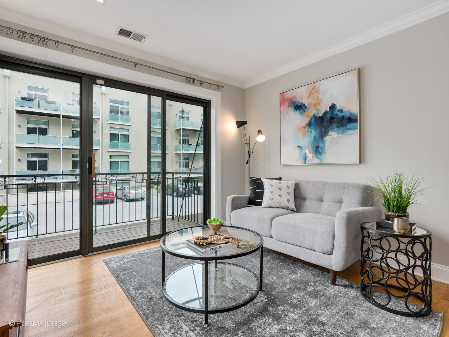 4144 North Sheridan Road, Unit 203 Chicago, IL 60613 - Photo 3 of 15 a living room with furniture and a large window