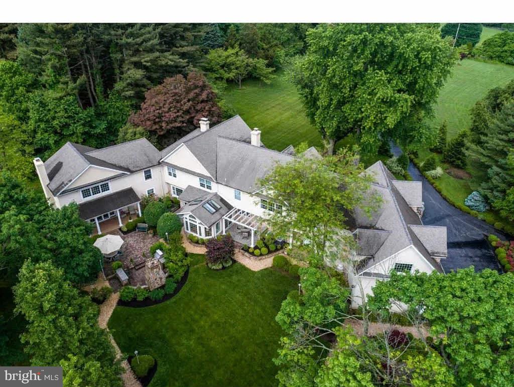 an aerial view of residential house with outdoor space and swimming pool