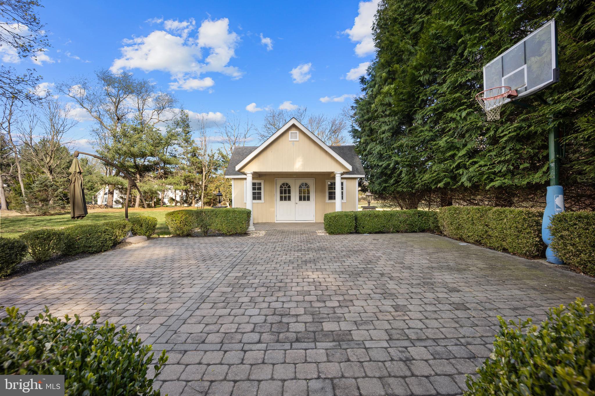 734 Northbrook Road Kennett Square, PA 19348 - Photo 13 of 89 a front view of a house with a yard and a garden