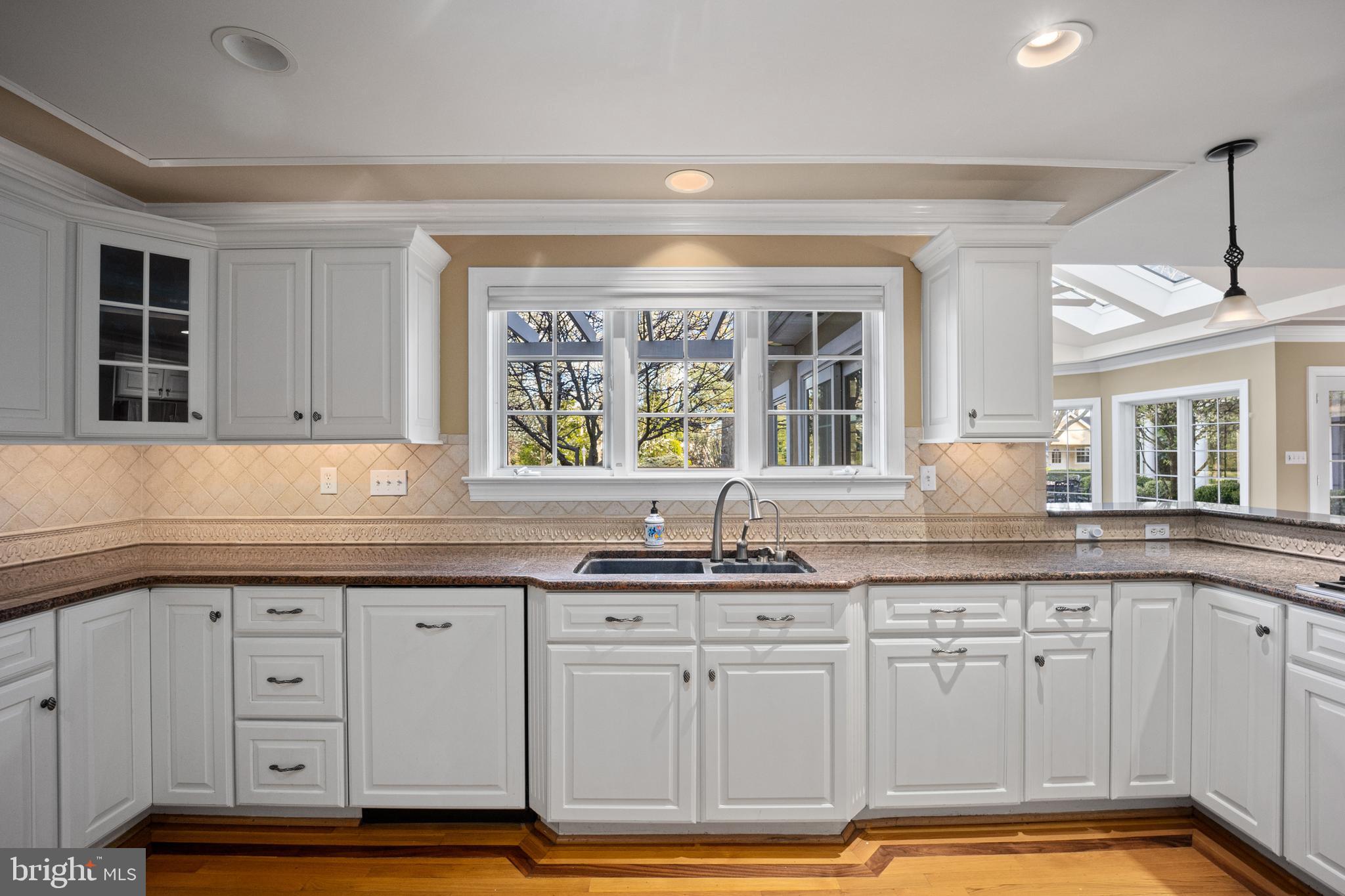 734 Northbrook Road Kennett Square, PA 19348 - Photo 27 of 89 a kitchen with granite countertop a sink window and cabinets