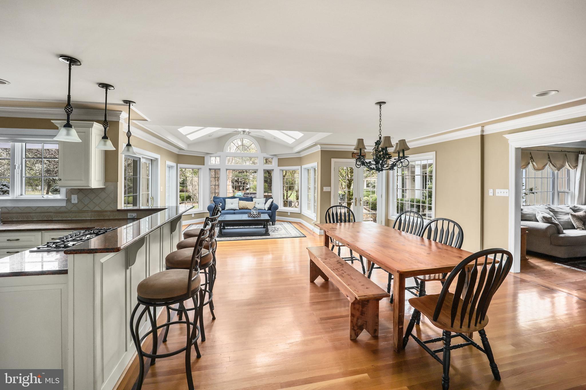 734 Northbrook Road Kennett Square, PA 19348 - Photo 30 of 89 a dining room with furniture a chandelier and wooden floor