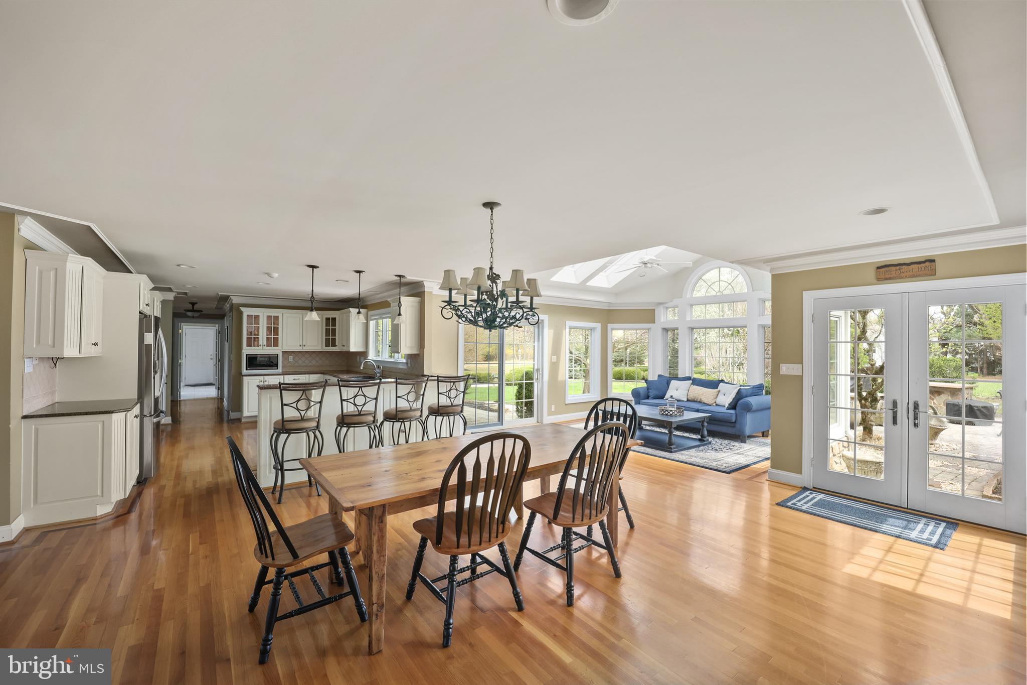 734 Northbrook Road Kennett Square, PA 19348 - Photo 31 of 89 a view of a dining room with furniture large windows and wooden floor