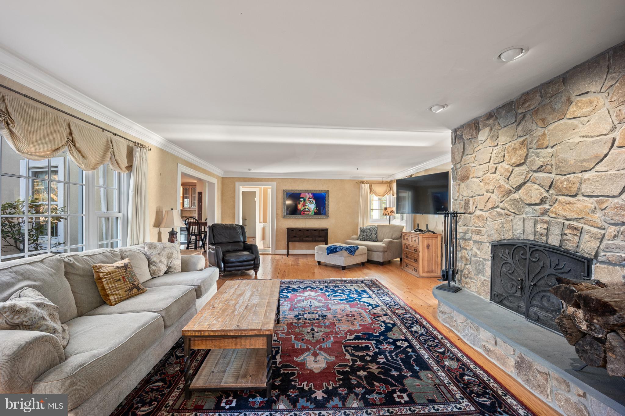 734 Northbrook Road Kennett Square, PA 19348 - Photo 41 of 89 a living room with furniture and a fireplace