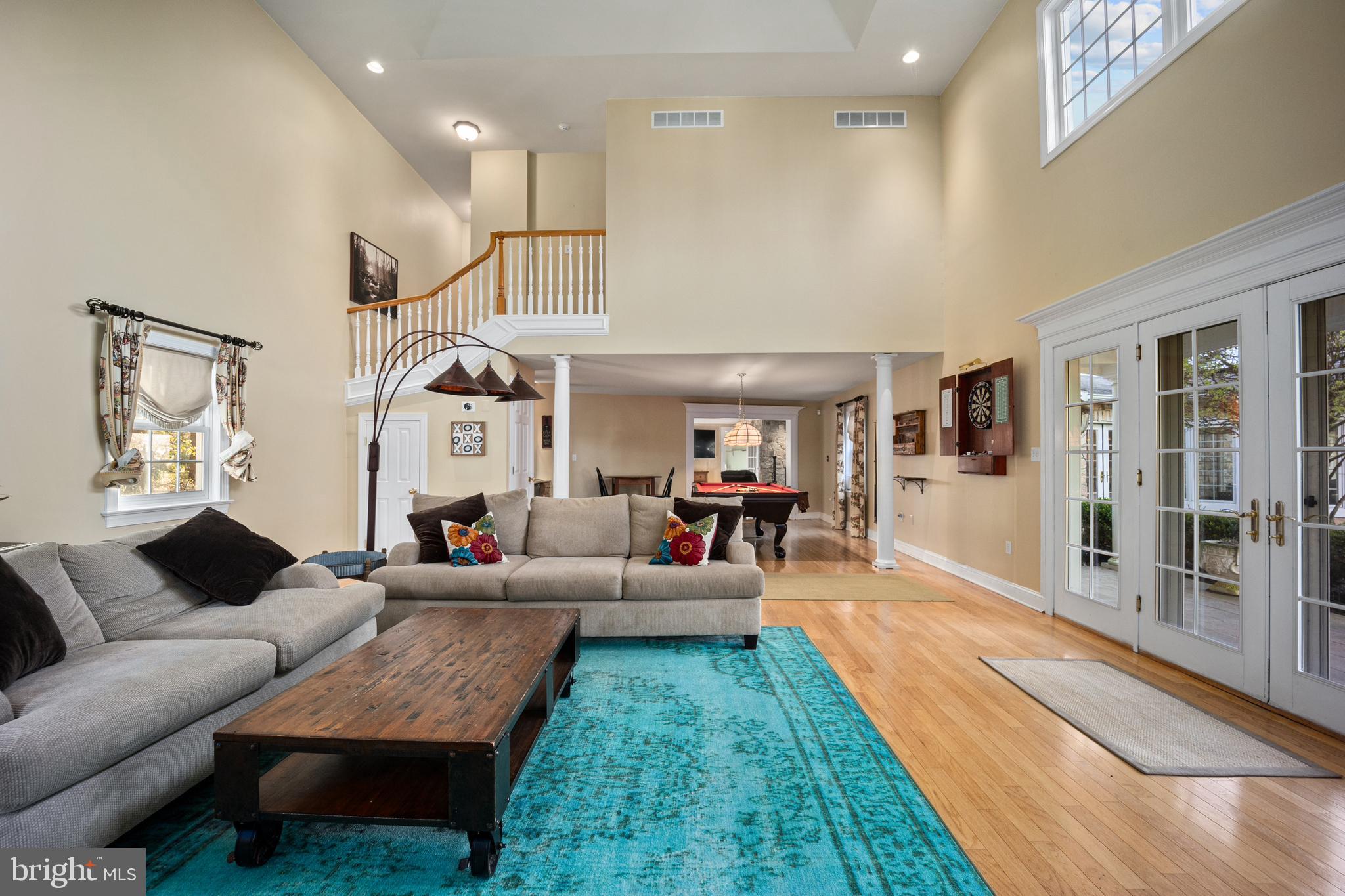 734 Northbrook Road Kennett Square, PA 19348 - Photo 46 of 89 a living room with furniture and a chandelier