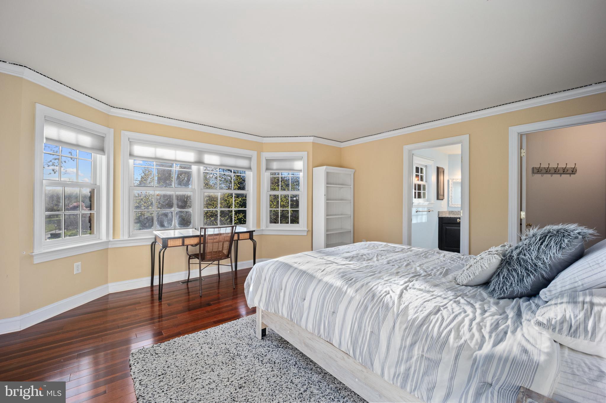 734 Northbrook Road Kennett Square, PA 19348 - Photo 75 of 89 a bedroom with a bed a large window and wooden floor