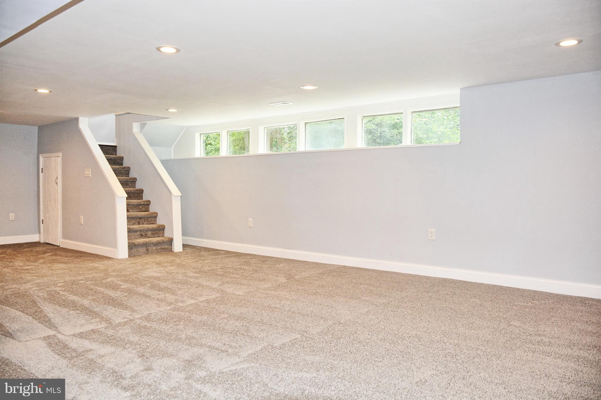 4716 Bonnie Brae Road Baltimore, MD 21208 - Photo 11 of 15 a view of an empty room with stairs