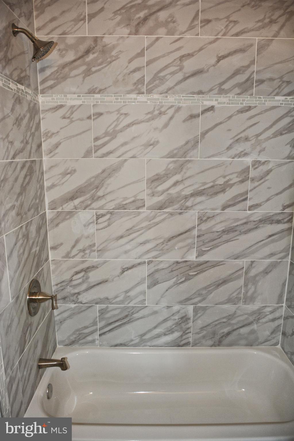 4716 Bonnie Brae Road Baltimore, MD 21208 - Photo 12 of 15 a bathroom with a bathtub