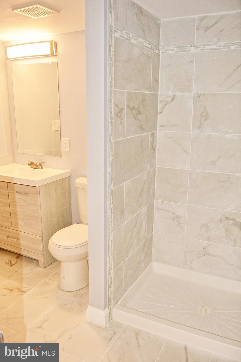 4716 Bonnie Brae Road Baltimore, MD 21208 - Photo 13 of 15 a bathroom with a toilet and a shower