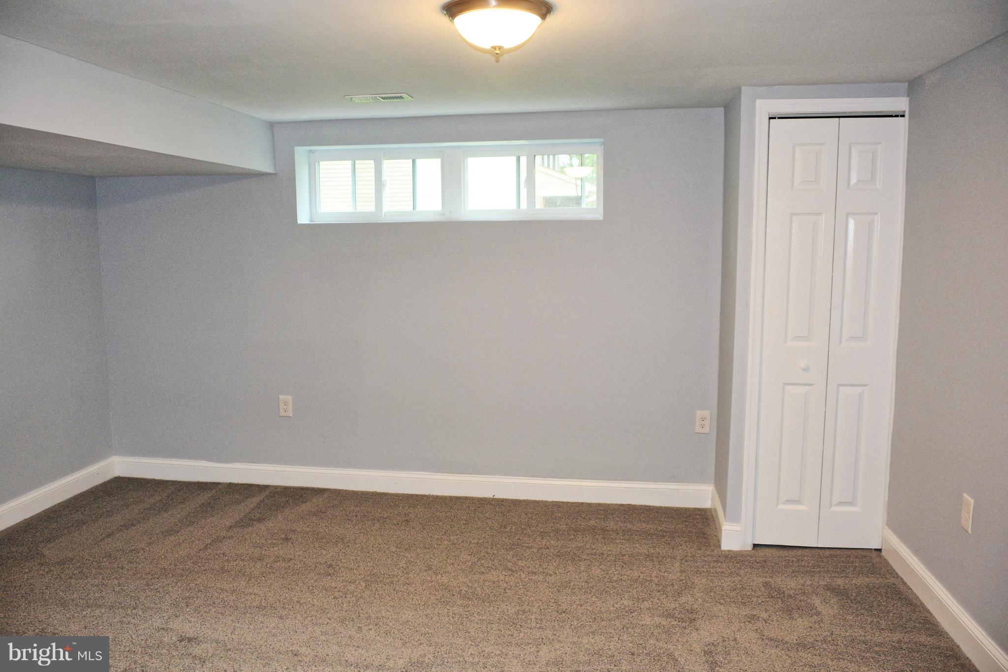 4716 Bonnie Brae Road Baltimore, MD 21208 - Photo 14 of 15 a view of an empty room with a window