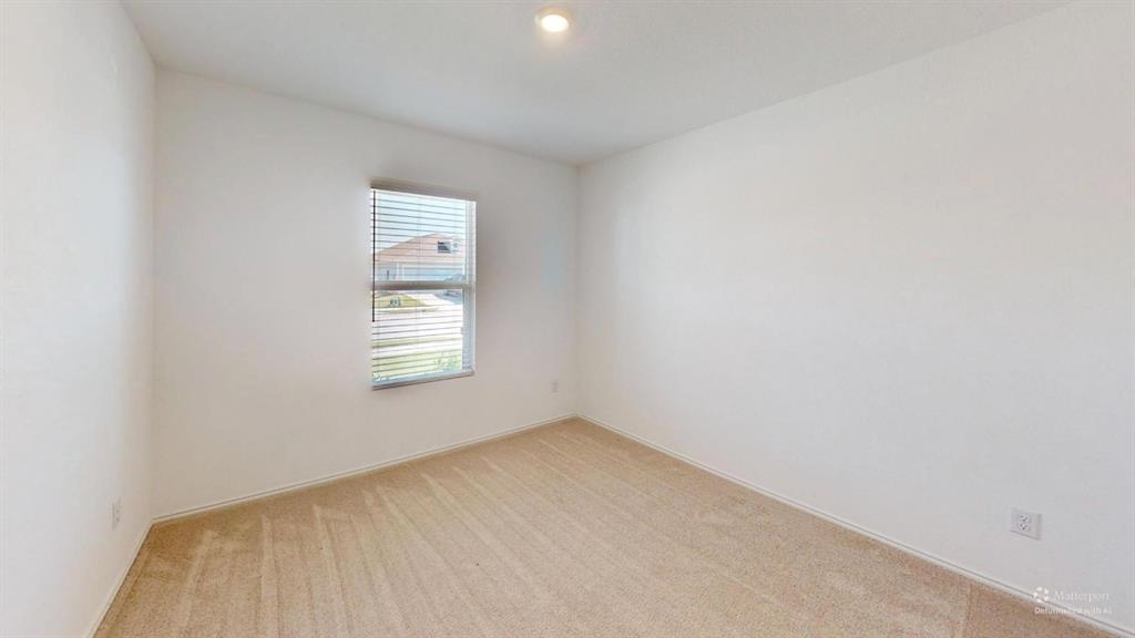 403 Ashbrook Way Princeton, TX 75407 - Photo 18 of 23 Neutral toned room featuring a single window with horizontal blinds, overhead recessed lighting, light-colored carpeting, and white baseboards