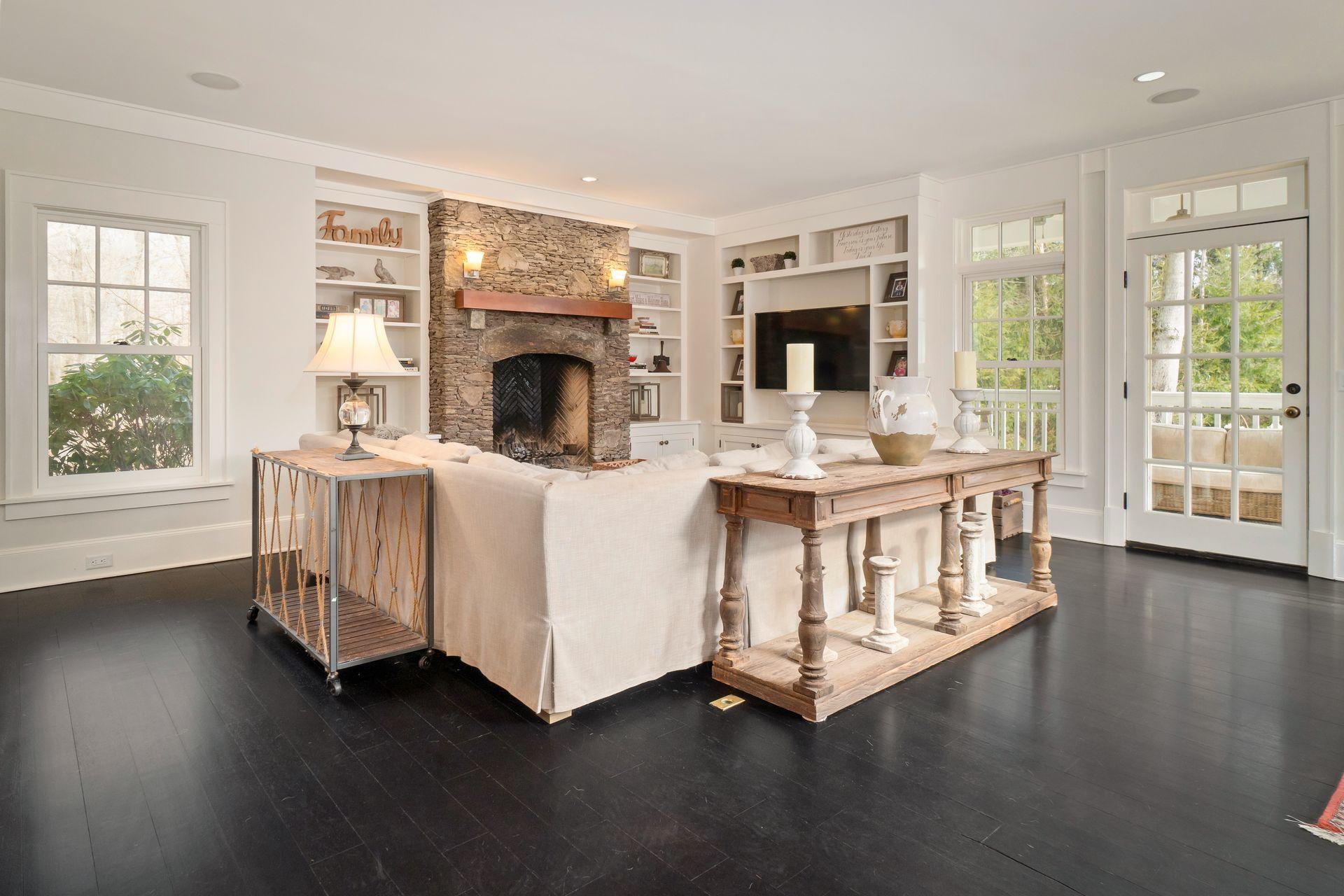 57 Rilling Ridge New Canaan, CT 06840 - Photo 22 of 68 a living room with furniture and a fireplace