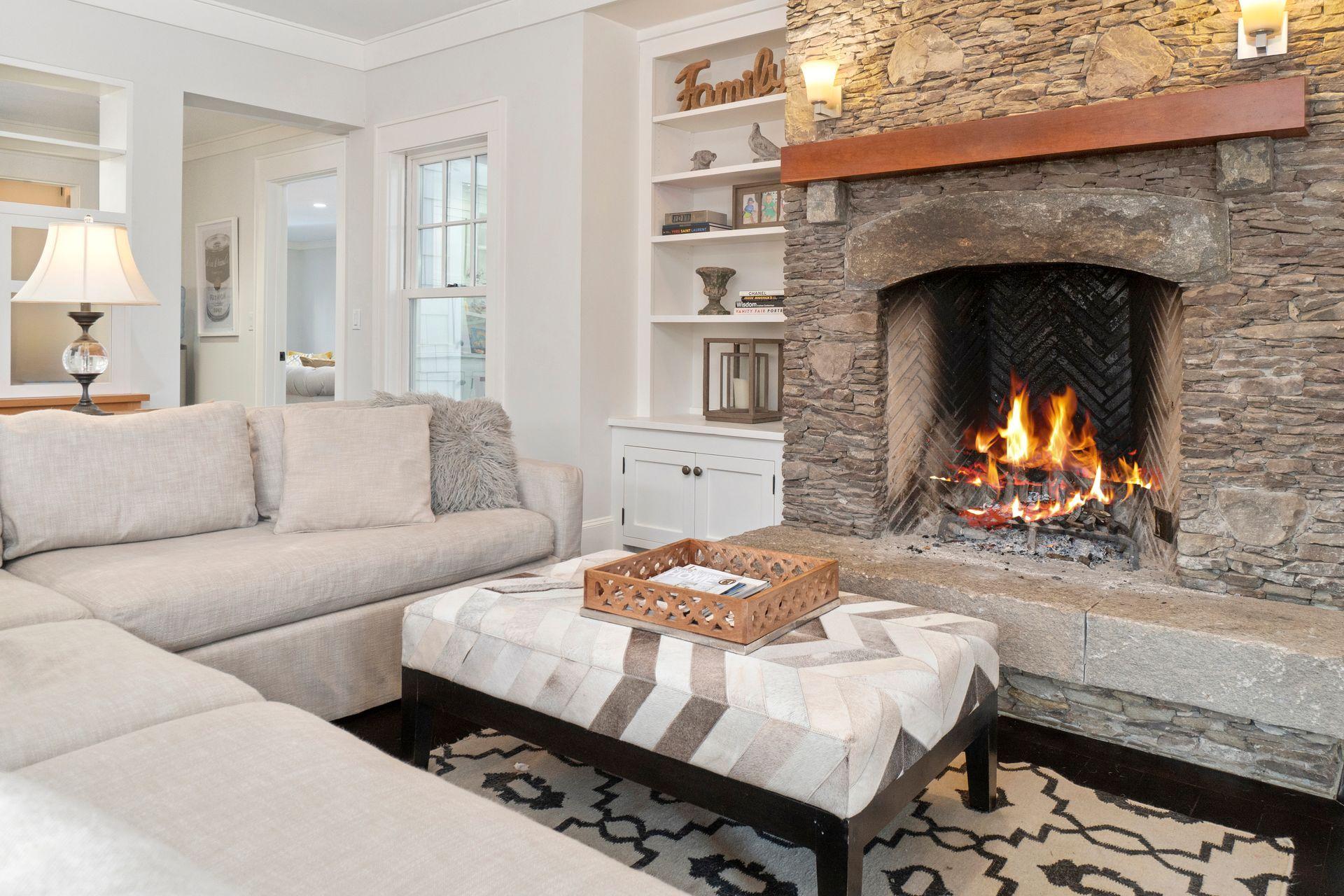 57 Rilling Ridge New Canaan, CT 06840 - Photo 24 of 68 a living room with furniture and a fireplace