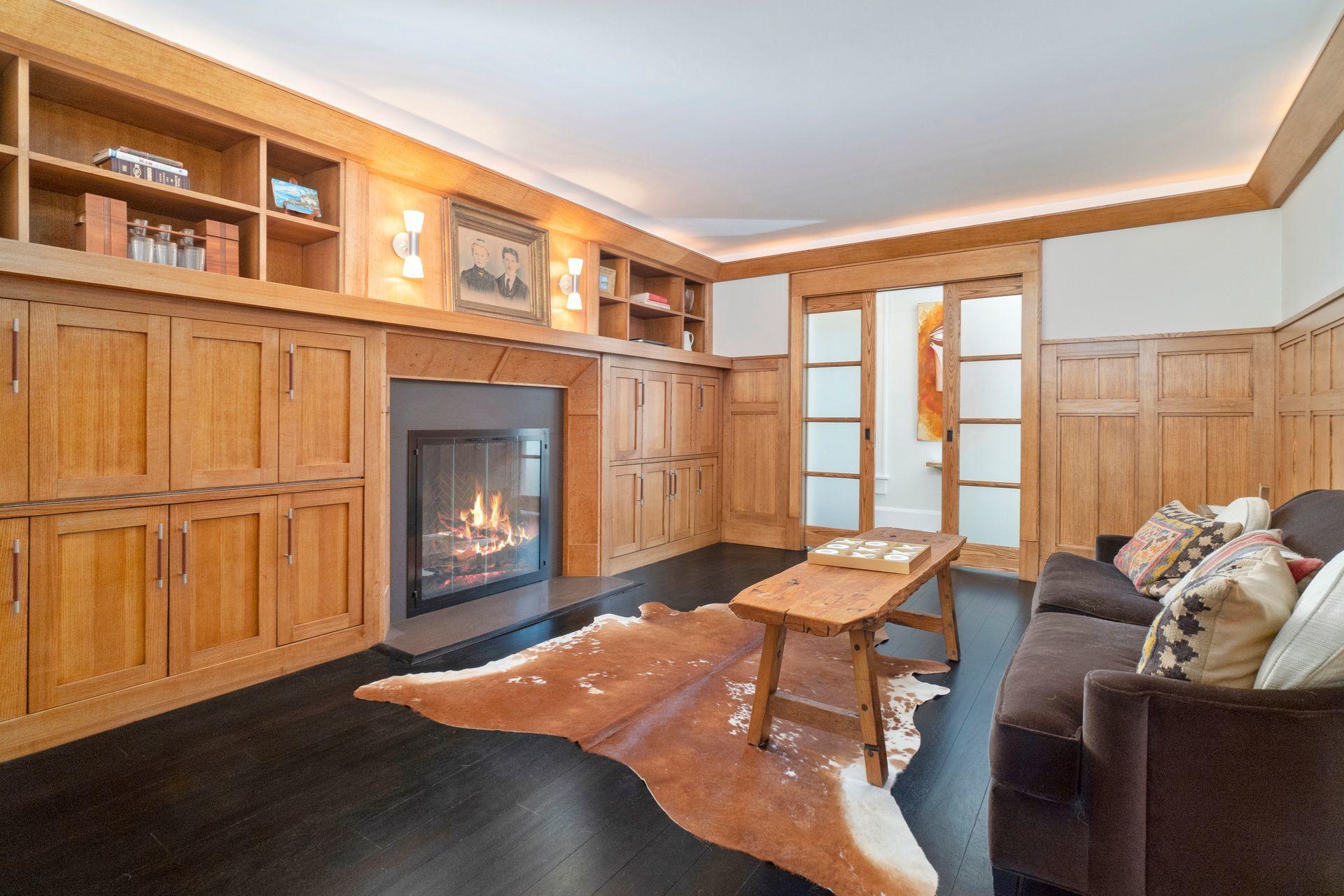 57 Rilling Ridge New Canaan, CT 06840 - Photo 26 of 68 a living room with furniture and a fireplace