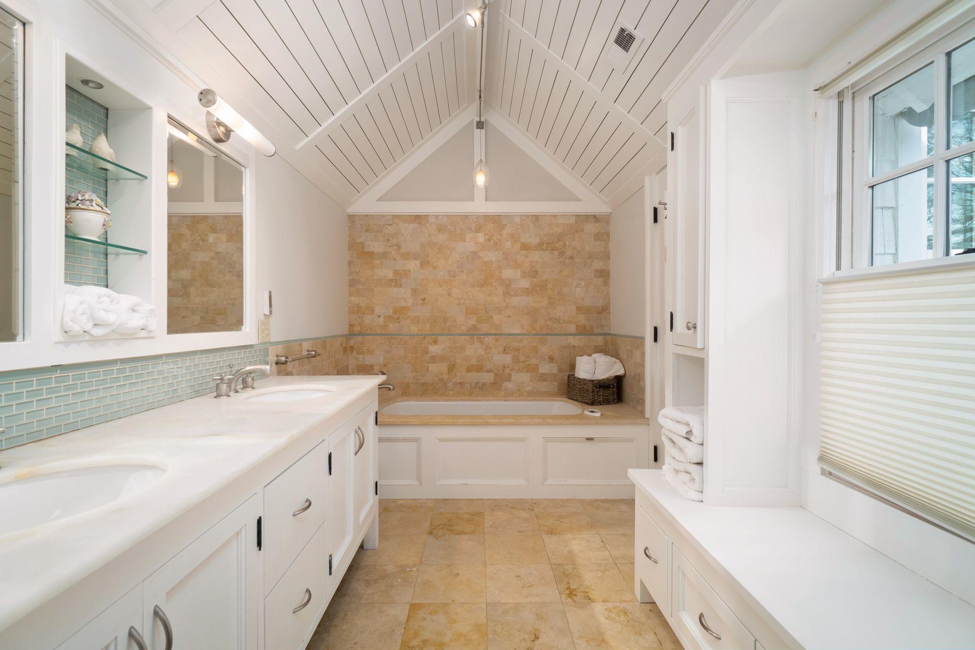 57 Rilling Ridge New Canaan, CT 06840 - Photo 32 of 68 a bathroom with a granite countertop bathtub sink vanity and a bathtub